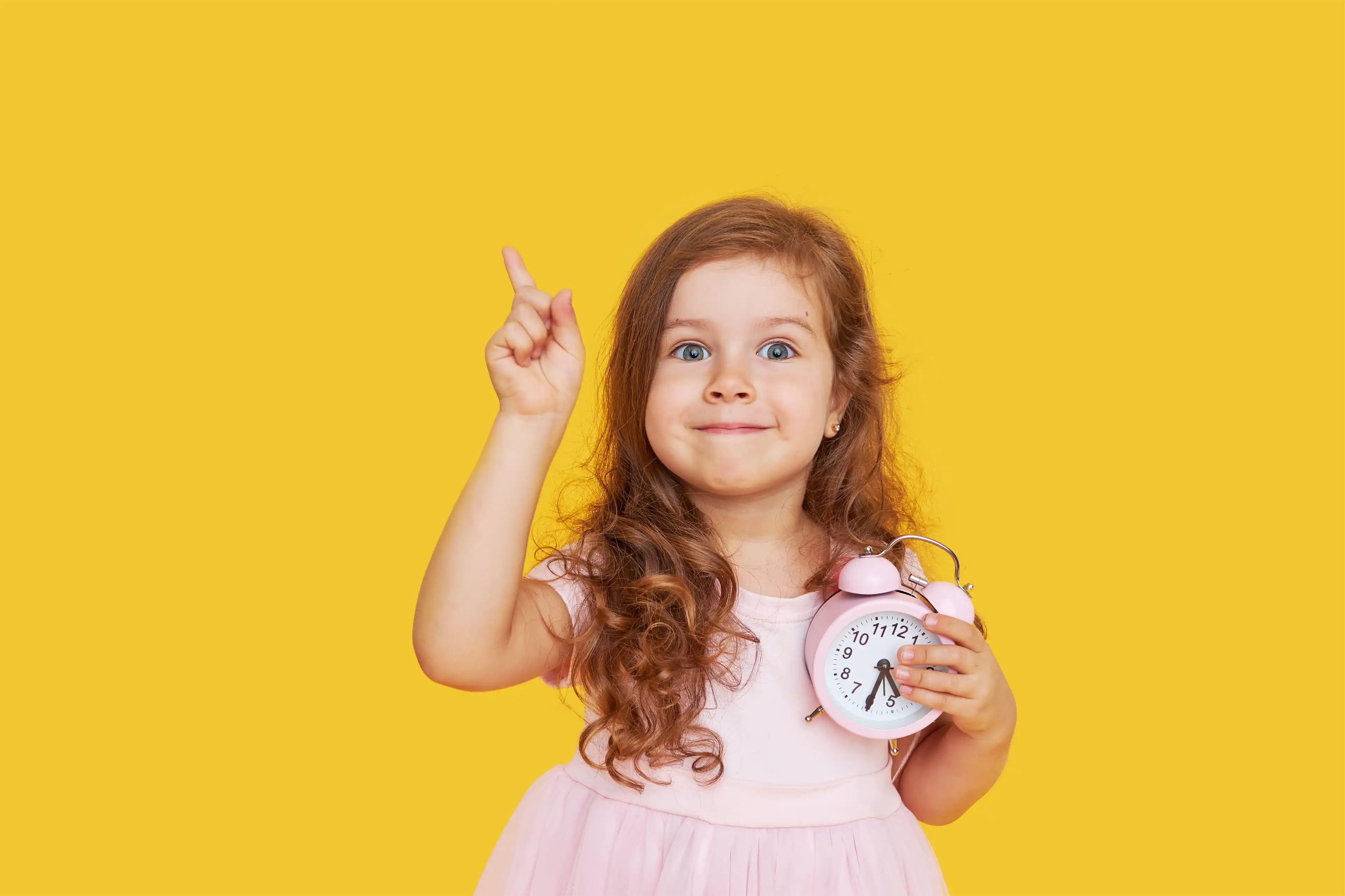 Happy child pointing up in a nurturing environment