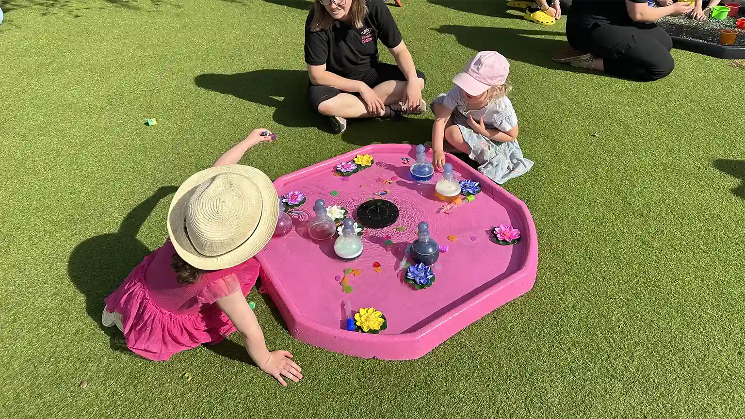 Child sharing with parent at Blossoms Childcare